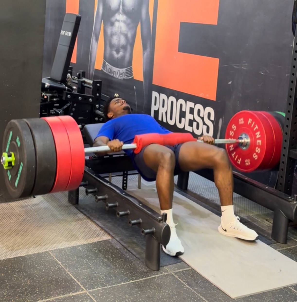 A coached bench press in the room